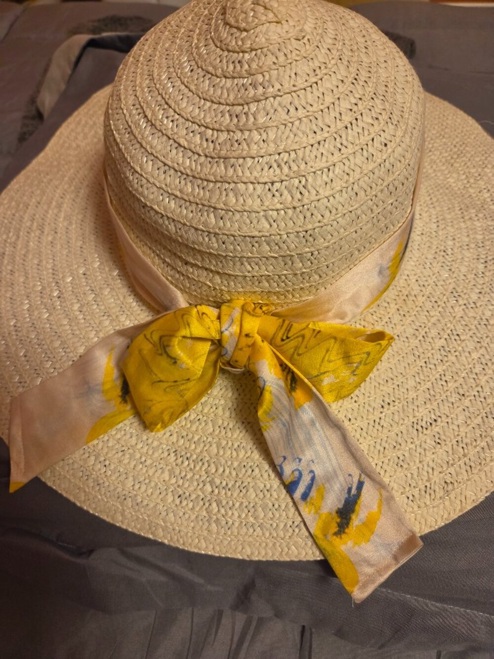 Wide rim Women's hat with beautiful ribbon.